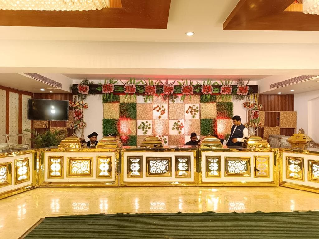 Grand buffet counter with floral backdrop